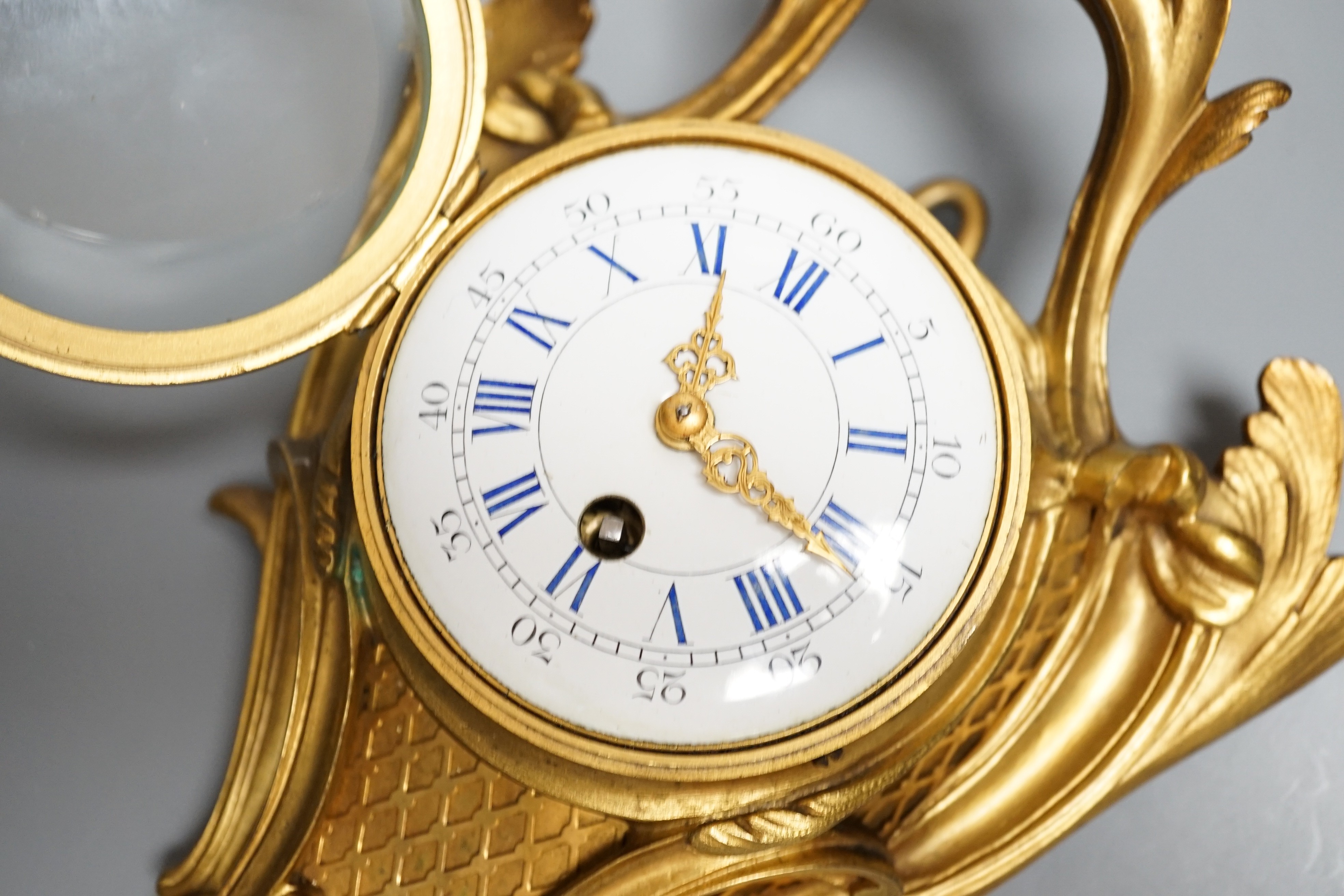 A 19th century French eight day ormolu cartel timepiece, height 29cm